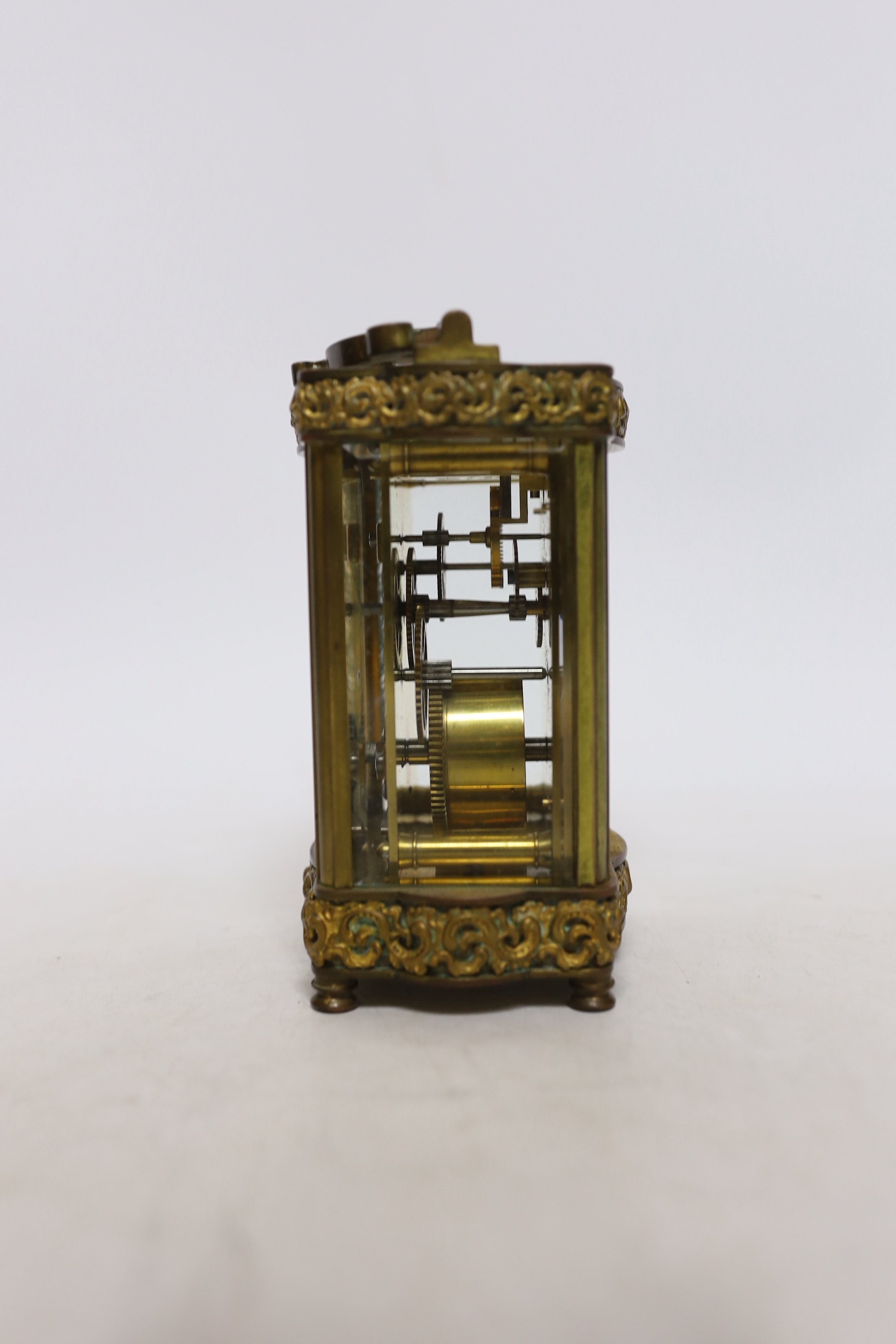 An early 20th century oak cased carriage timepiece, timepiece 12cm high